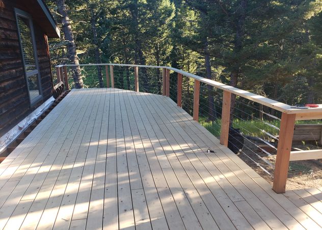 A beautiful cedar deck with wire railing. 