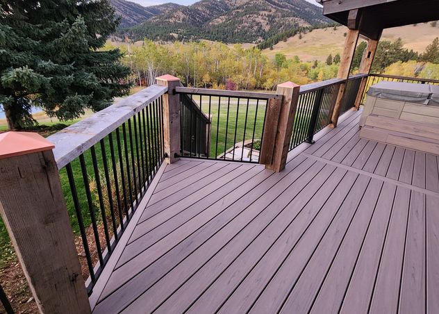 Composite deck with gate and refurbished posts with copper caps