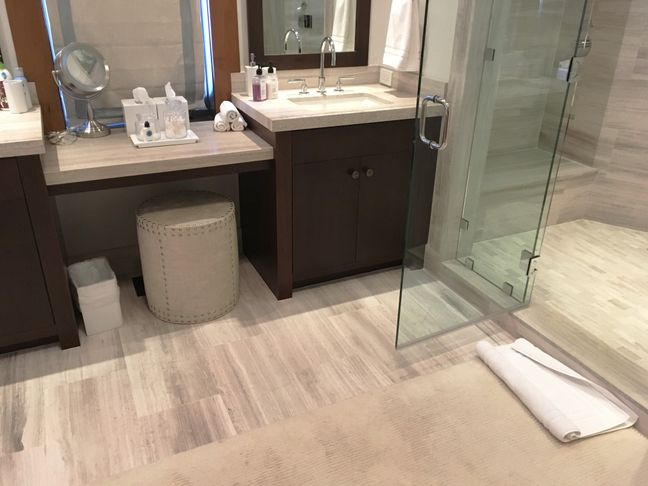 Bathroom remodel with new cabinets, tile backsplash, floor and glass door