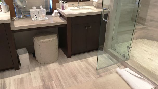 Bathroom remodel with new cabinets, tile backsplash, floor and glass door