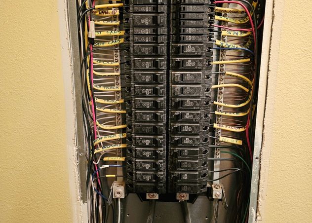 Close-up of a labeled residential breaker panel rewired during an electrical service upgrade in Bozeman