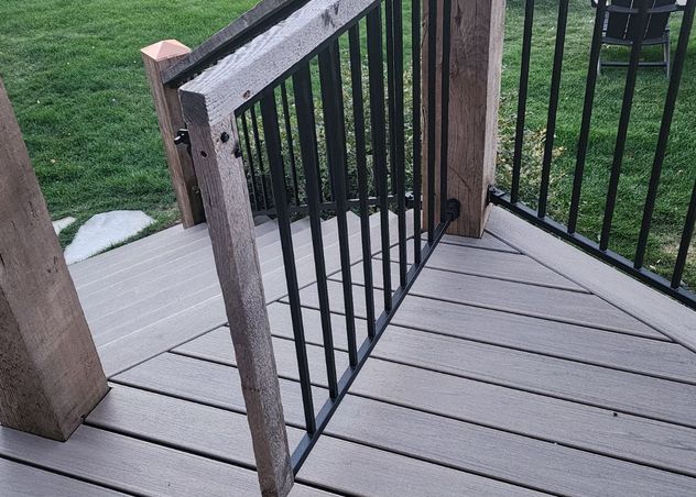 Gate with refurbished wood around new metal balusters. 