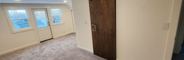 Interior remodel of 1920s home with barn door insert by Hutch Construction